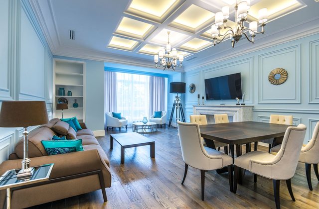 A living and dining room with the seating arranged around a low table