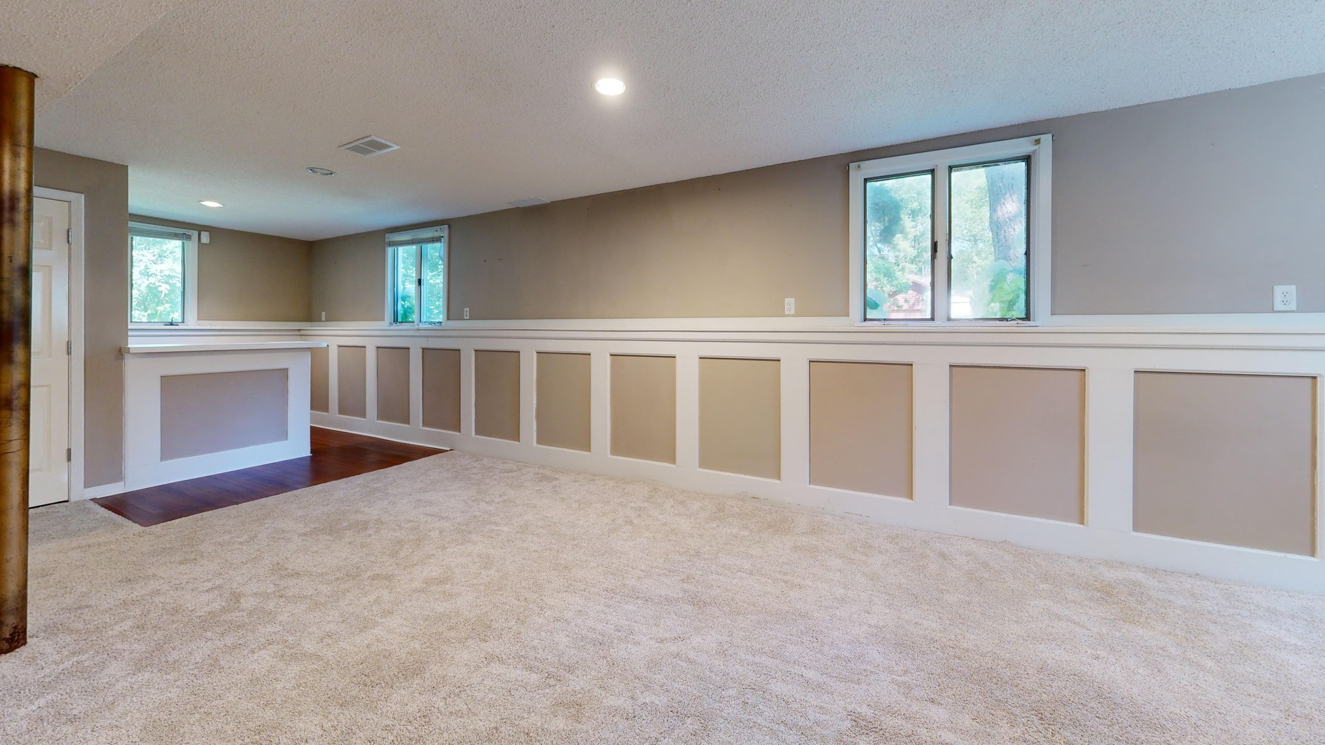 Bright and airy basement with ample natural light and modern decor