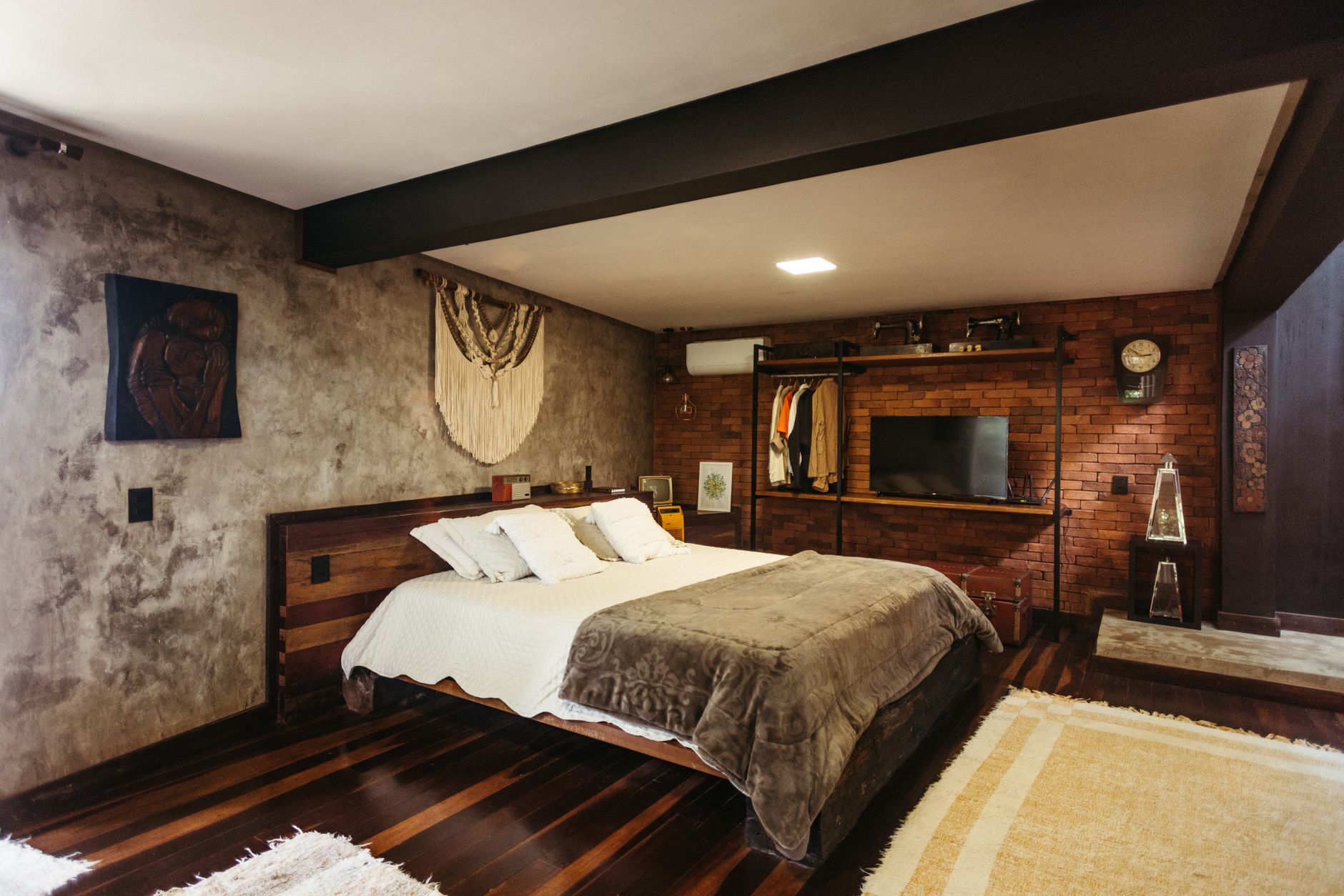 Stylish bedroom interior in Santa Teresa, Brazil featuring modern decor and warm tones, illustrating What Does Feng Shui Say About Bedroom Door Alignment