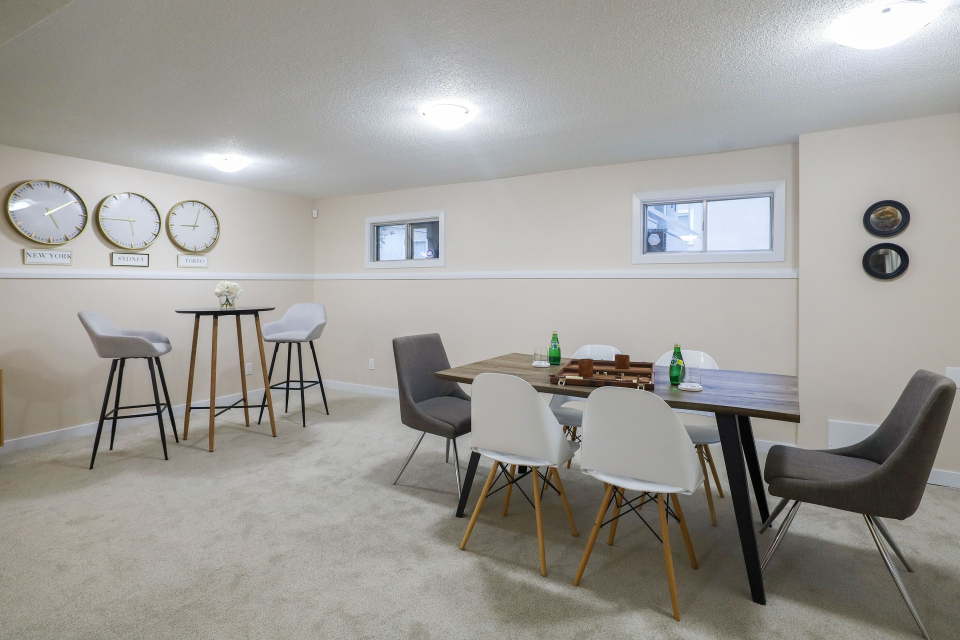 And elegant basement dining and living area with minimalist decor in Edmonton, Canada