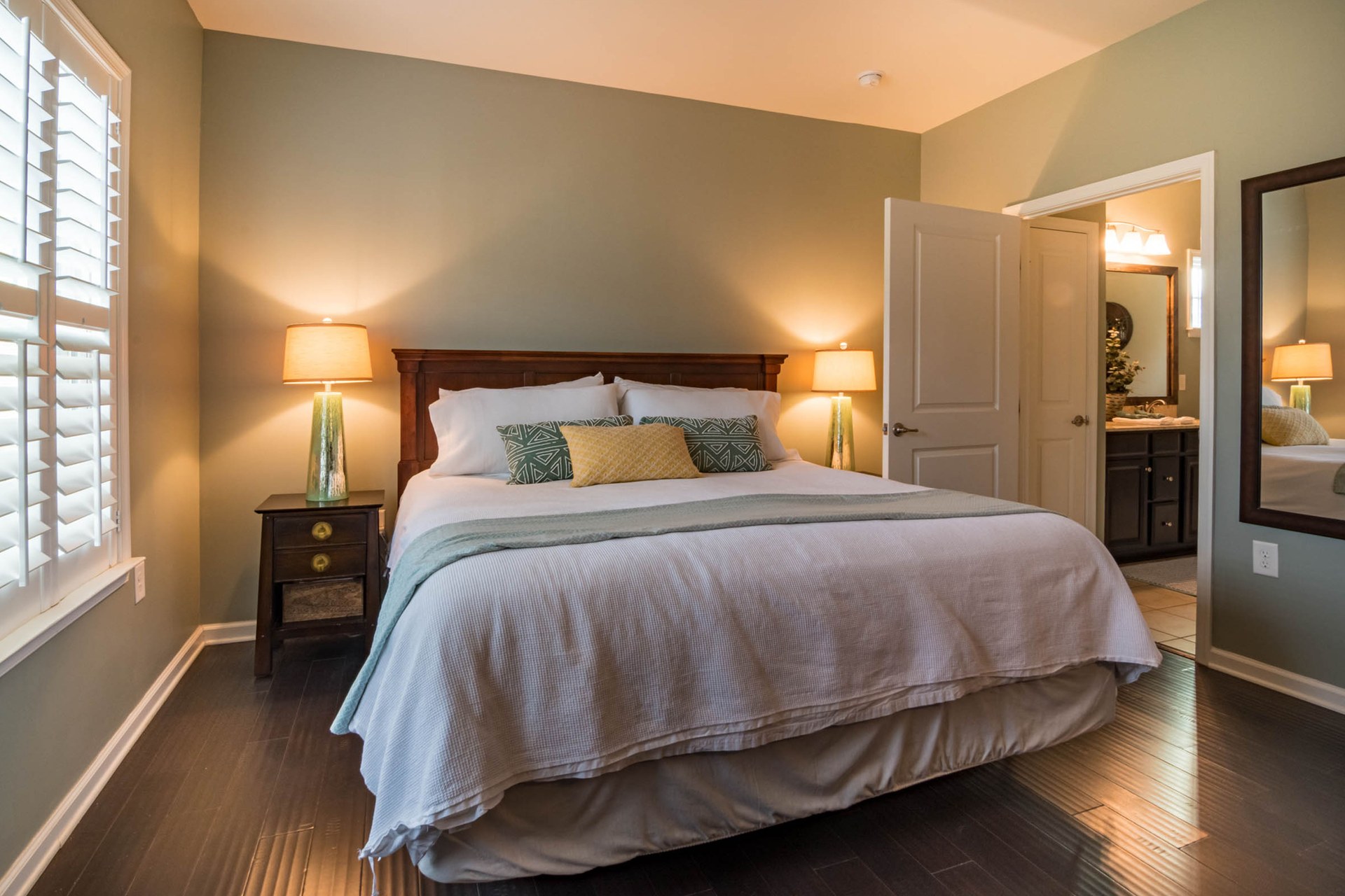 Bedroom featuring a comfortable bed, modern decor, and warm lighting for a relaxing ambiance