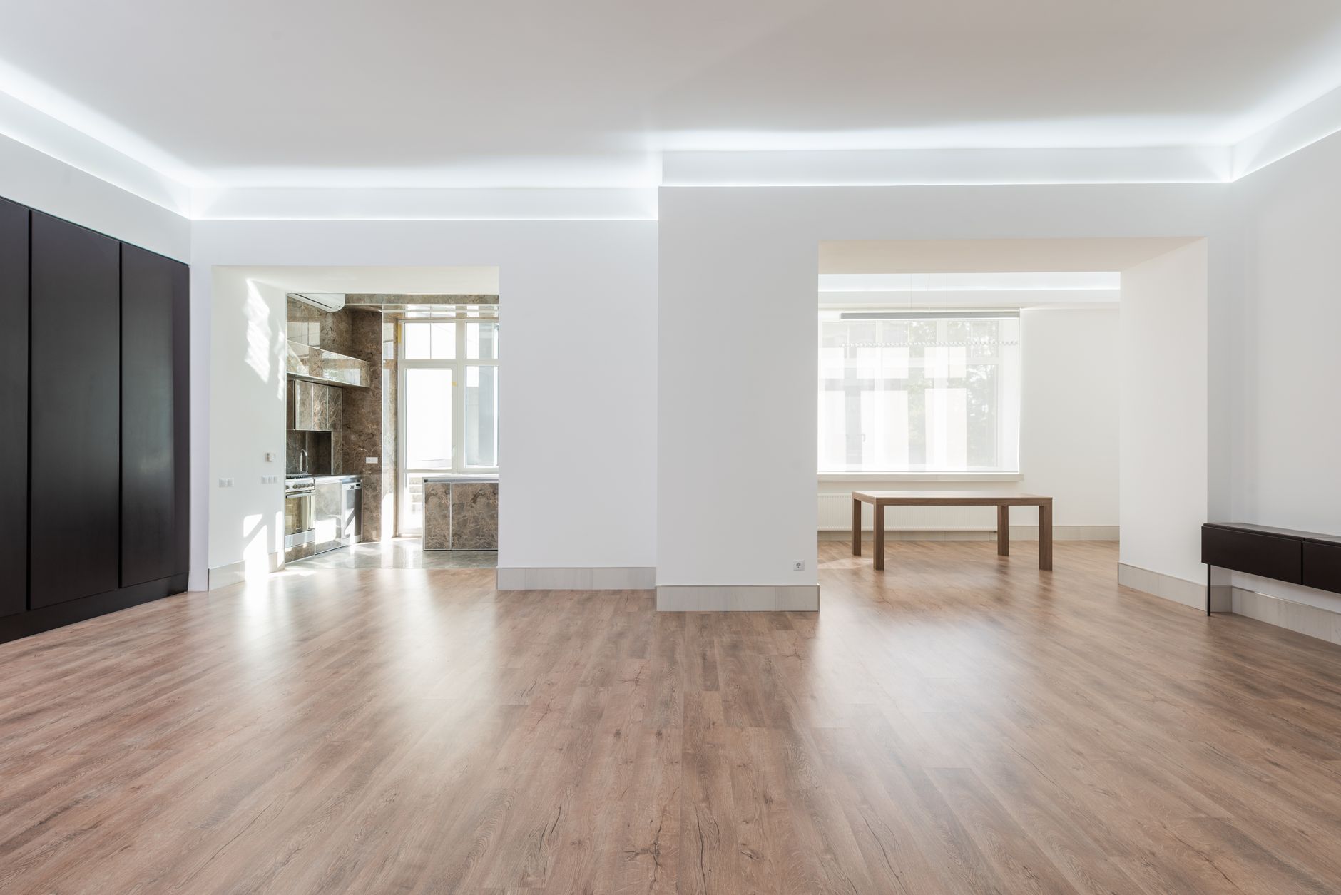 Bright and spacious empty room with wooden flooring, modern design, ideal for interior design inspiration, illustrating What Feng Shui Says About Moving In, and In What Order