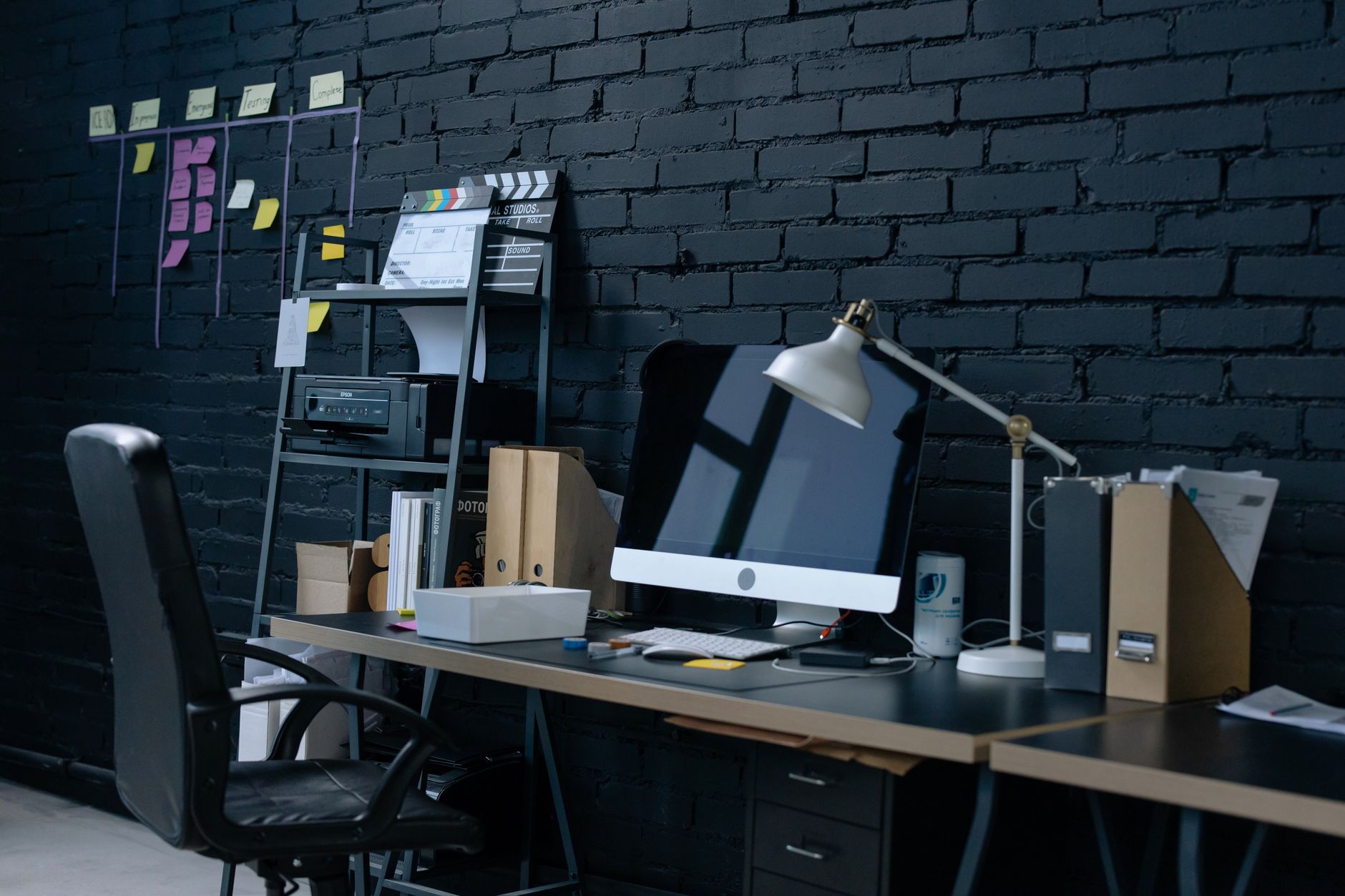 Stylish home office setup with desktop computer and organized workspace, illustrating What Feng Shui Says About a Home Office in a Bedroom