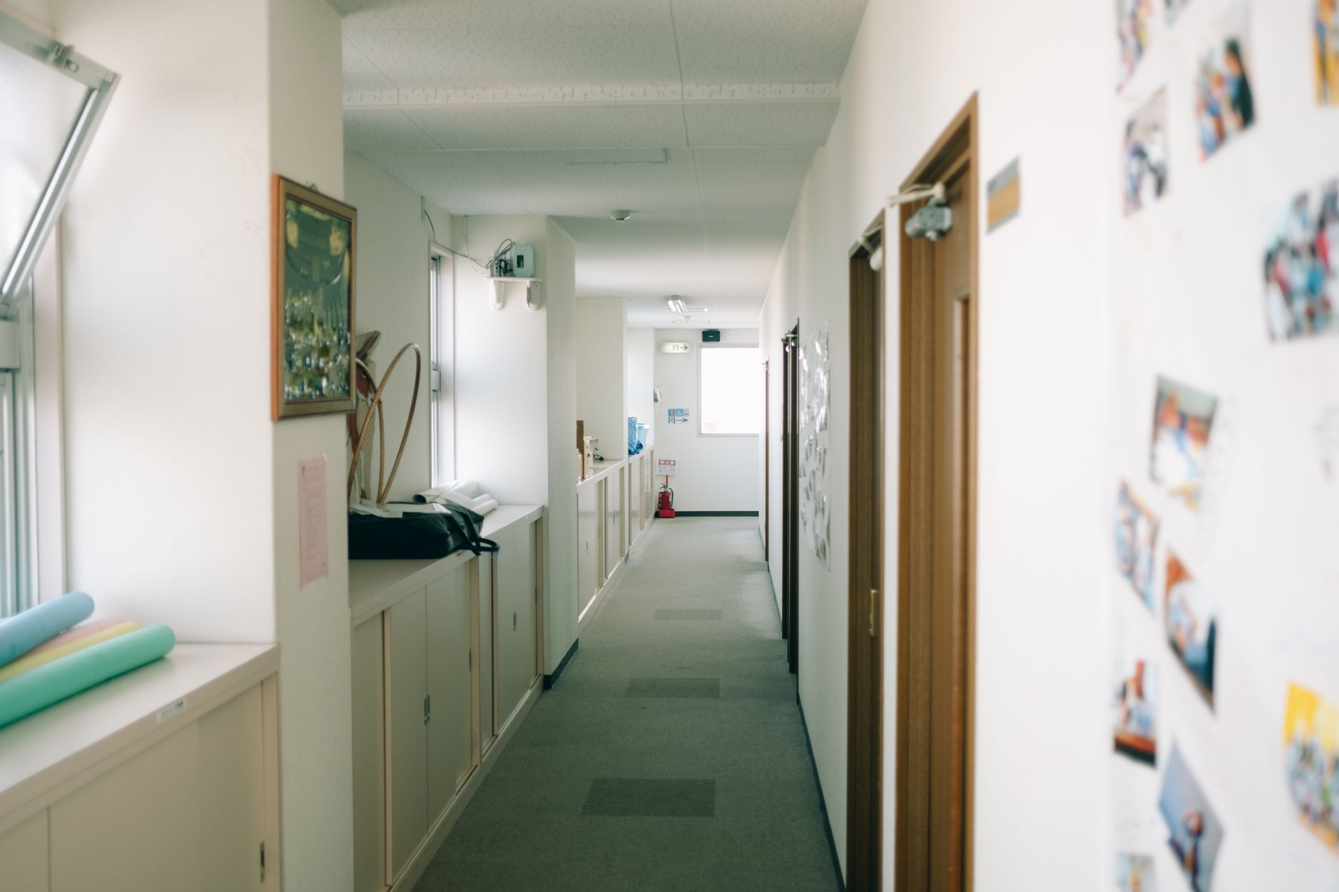 Spacious and well lit indoor hallway featuring decor and open doors, illustrating How Do You Handle a Home With No Hallway