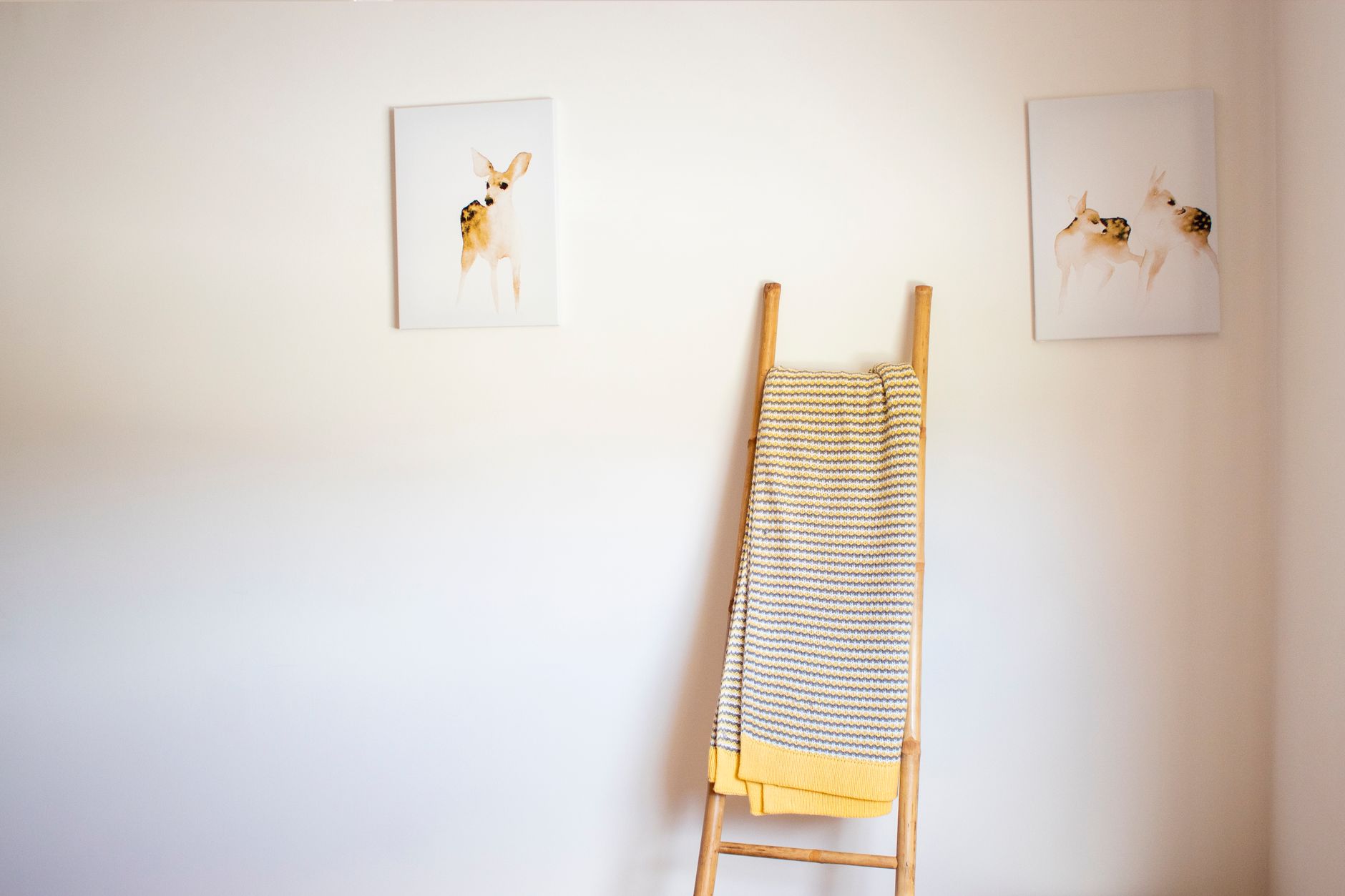 Simple minimalist interior featuring a wooden ladder and decorative abstract art, illustrating Is There Evidence for Feng Shui? What Kind Exists