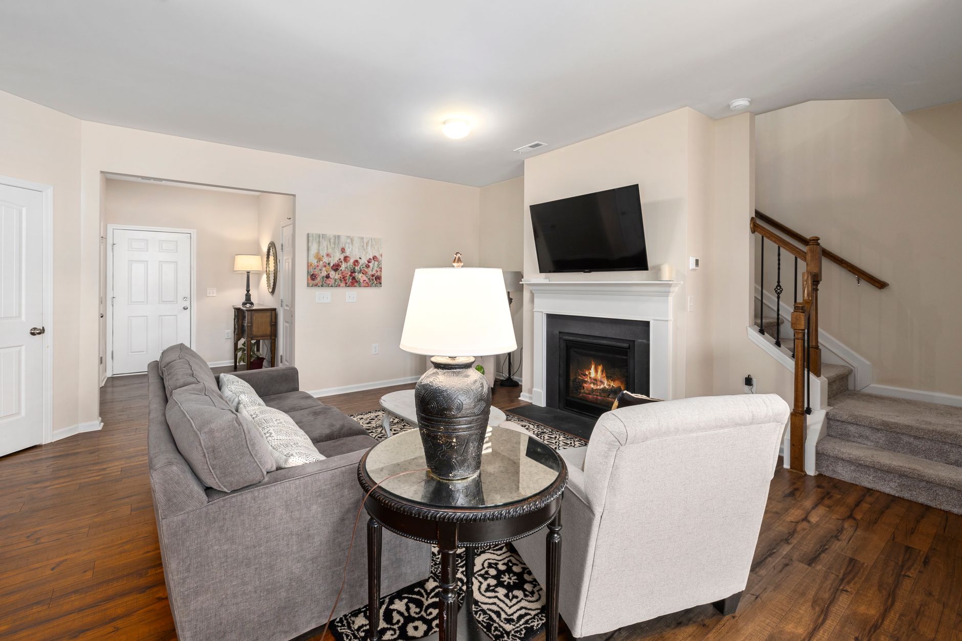 Elegant and cozy living room featuring a fireplace and modern decor, perfect for relaxation, illustrating How Should a Living Room Be Arranged for Conversation