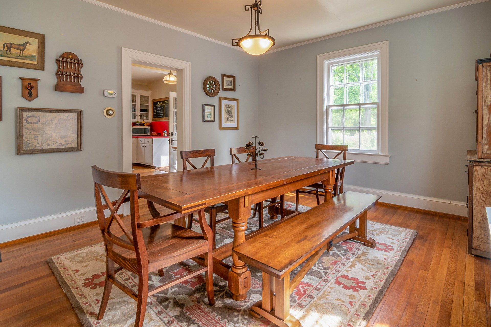 Dining room featuring wooden furniture and rustic wall decor, perfect for family gatherings