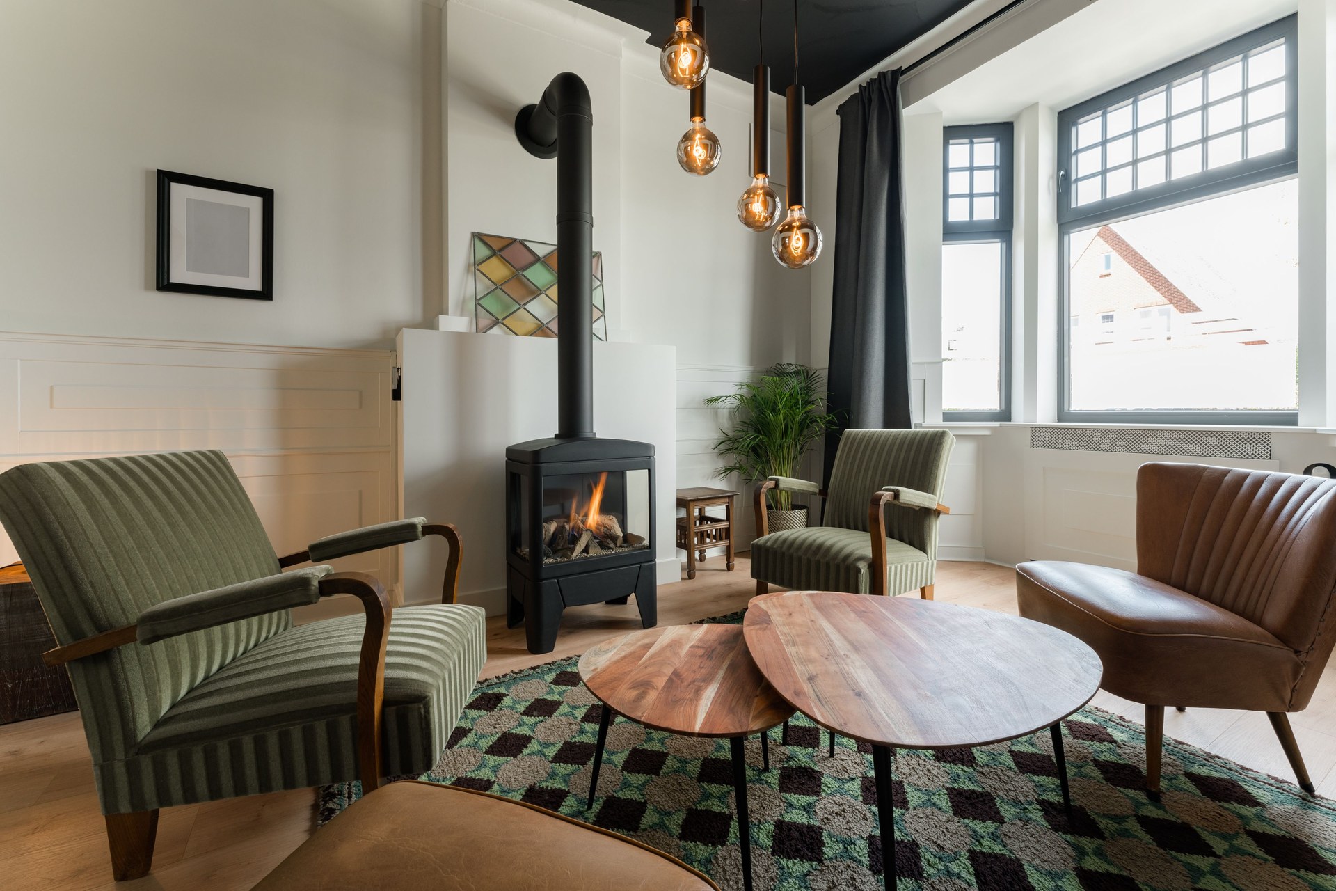 Living room featuring a stylish fireplace, comfortable seating, and modern decor