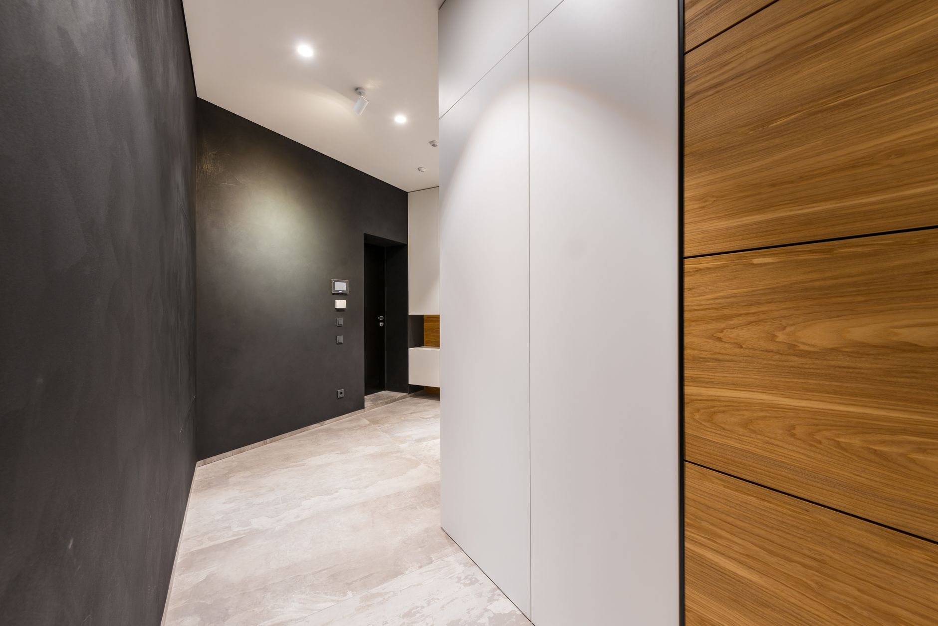 Sleek modern hallway with wood paneling and minimalist design, perfect for contemporary interiors, illustrating Two Doors Facing Each Other: What Feng Shui Actually Says