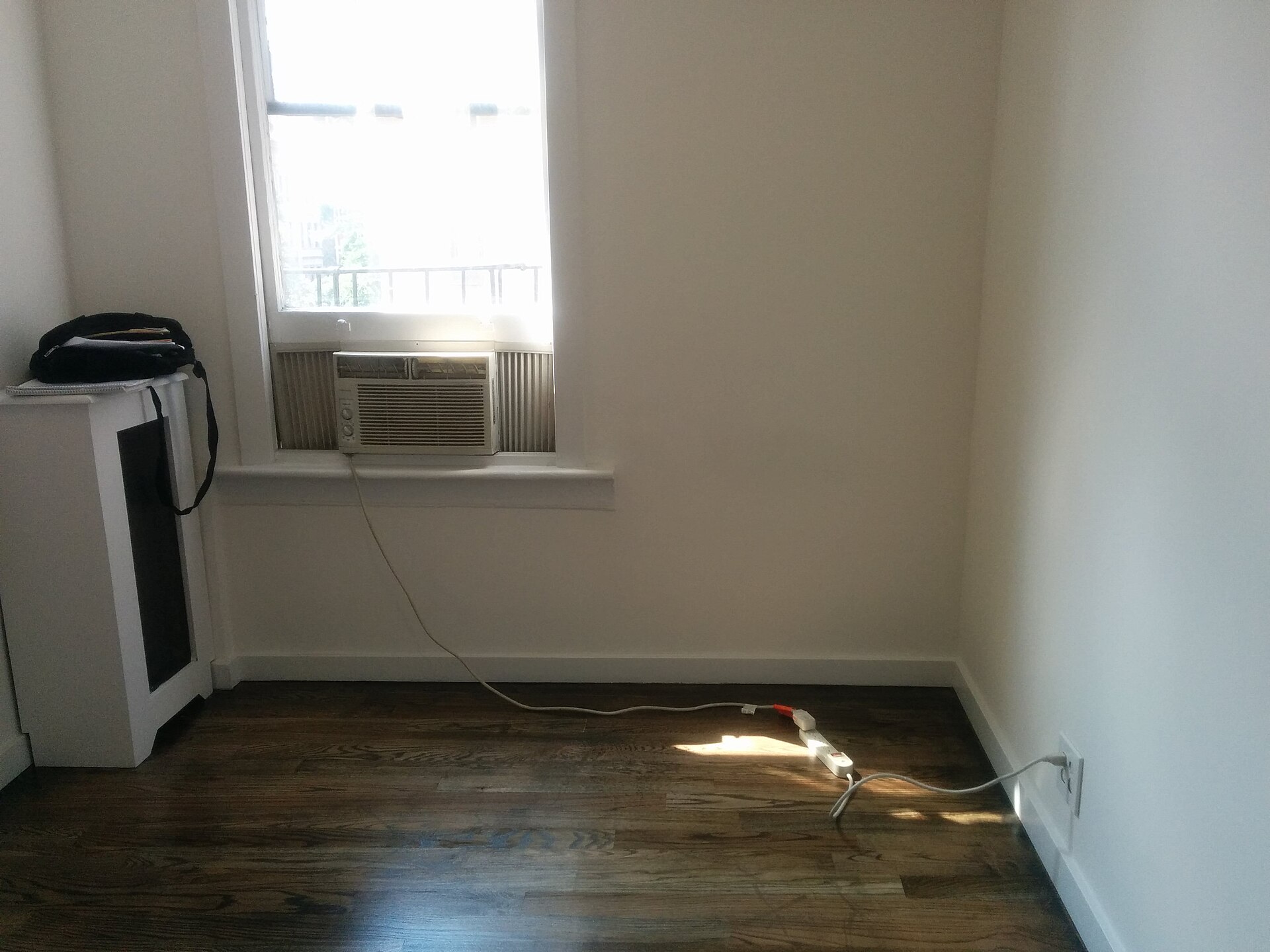 Empty apartment room with extension cord, illustrating What Can a Renter Actually Change? A Feng Shui Guide