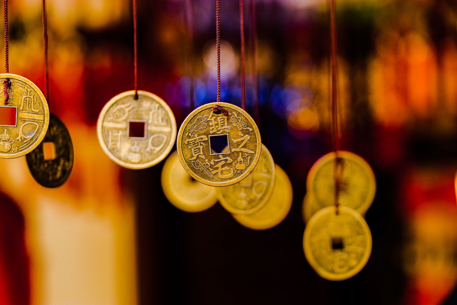 A vibrant display of hanging Feng Shui coins, symbolizing wealth and prosperity. — illustrating What Is Feng Shui, and Where Does It Come From?