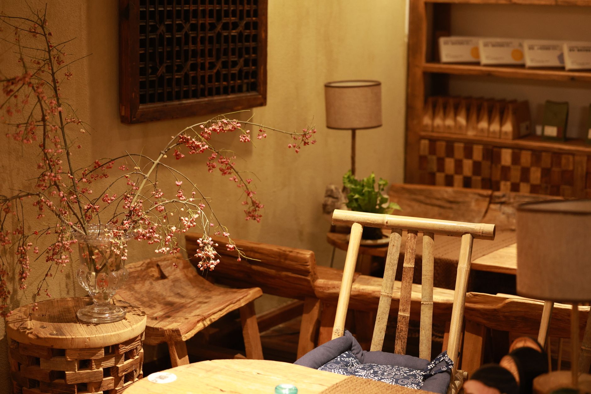 Warm and inviting rustic coffee shop interior with wooden furniture and soft lighting, illustrating What Is the Bagua, and How Is It Actually Used
